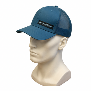 Blue cap with 'Bankside' logo on a mannequin head against a white background